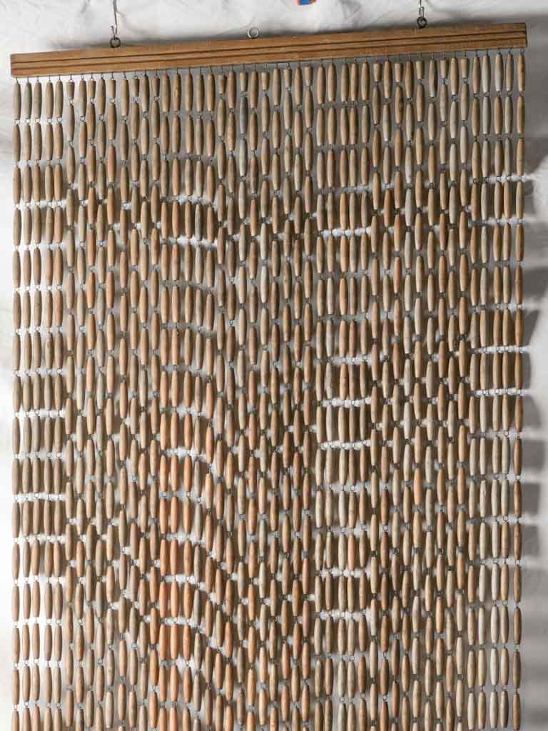 Functional insect-deterring beaded curtain