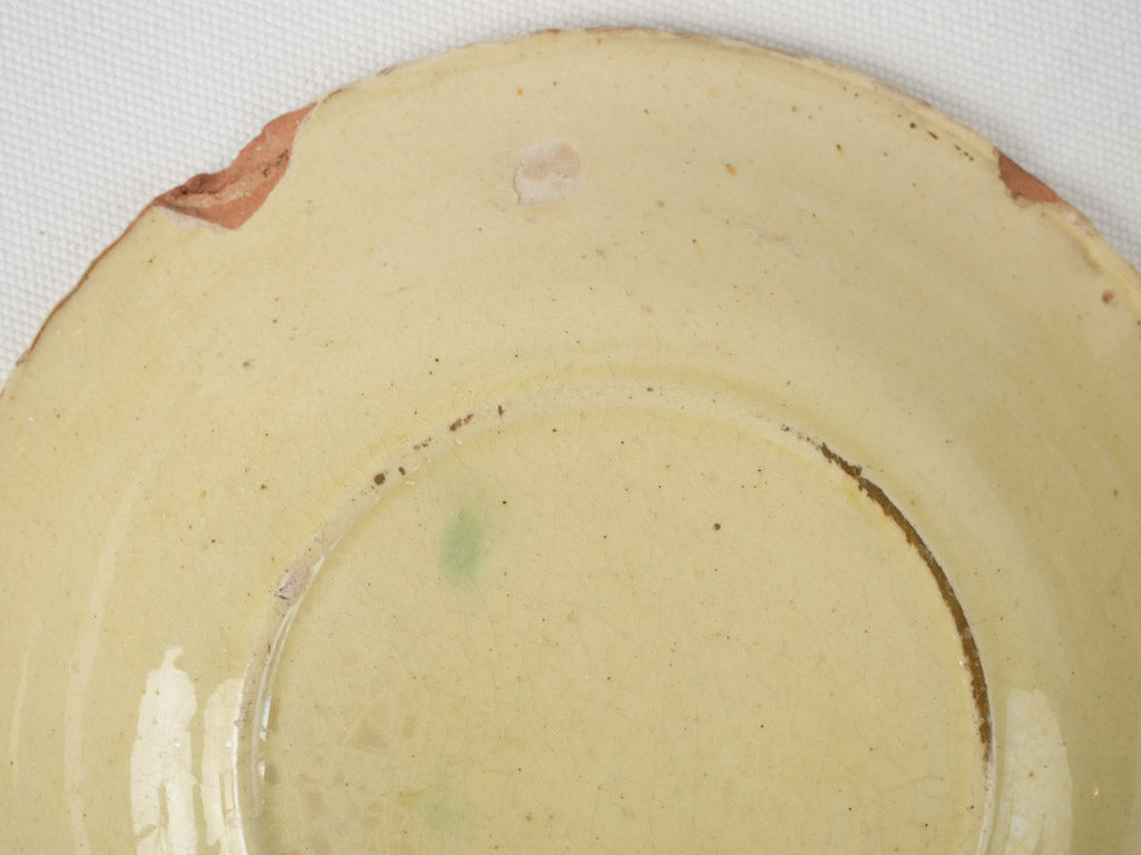 Aged, utilitarian, rippled-edge pottery plates