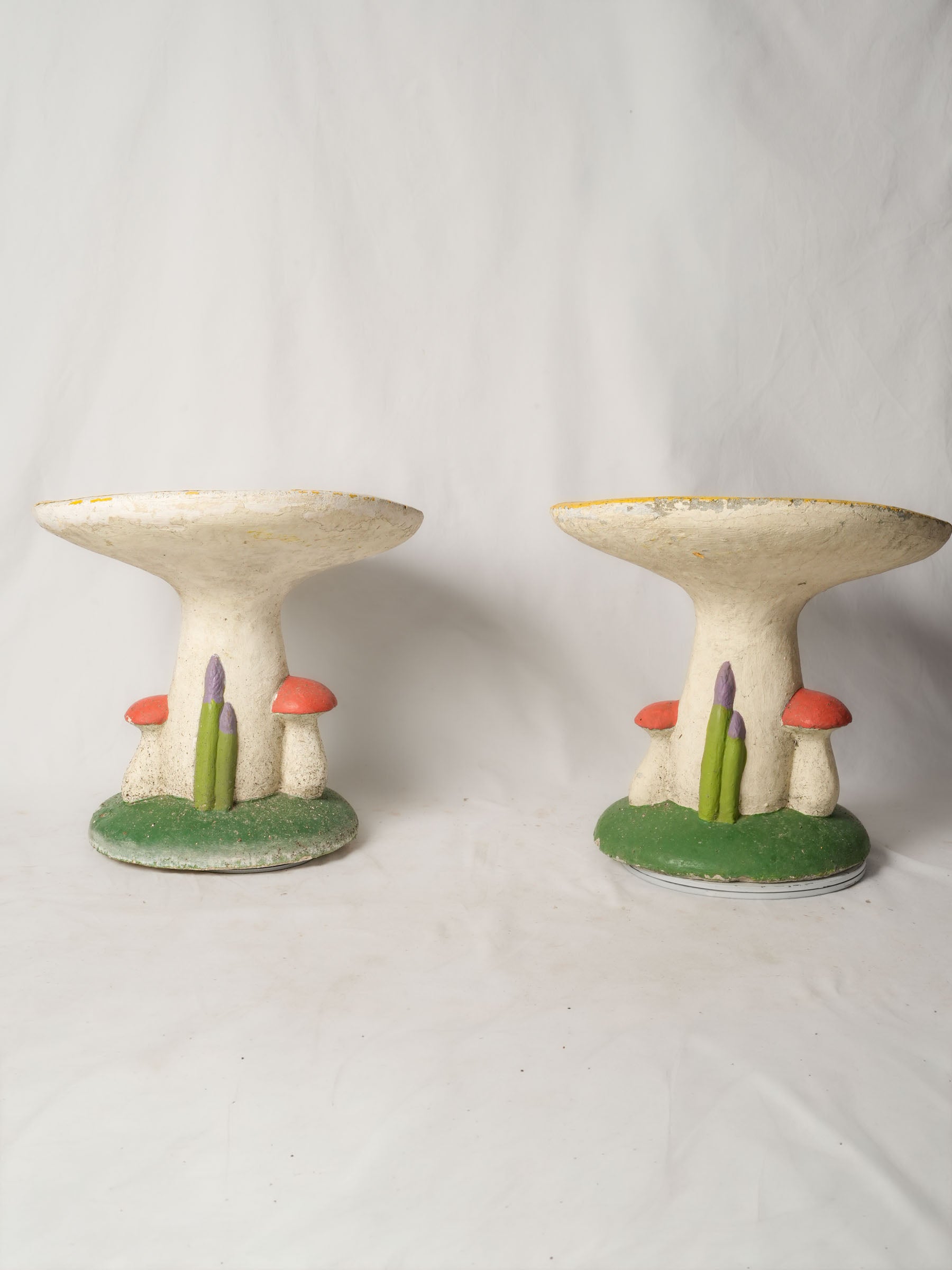 Weathered outdoor mushroom-form stools
