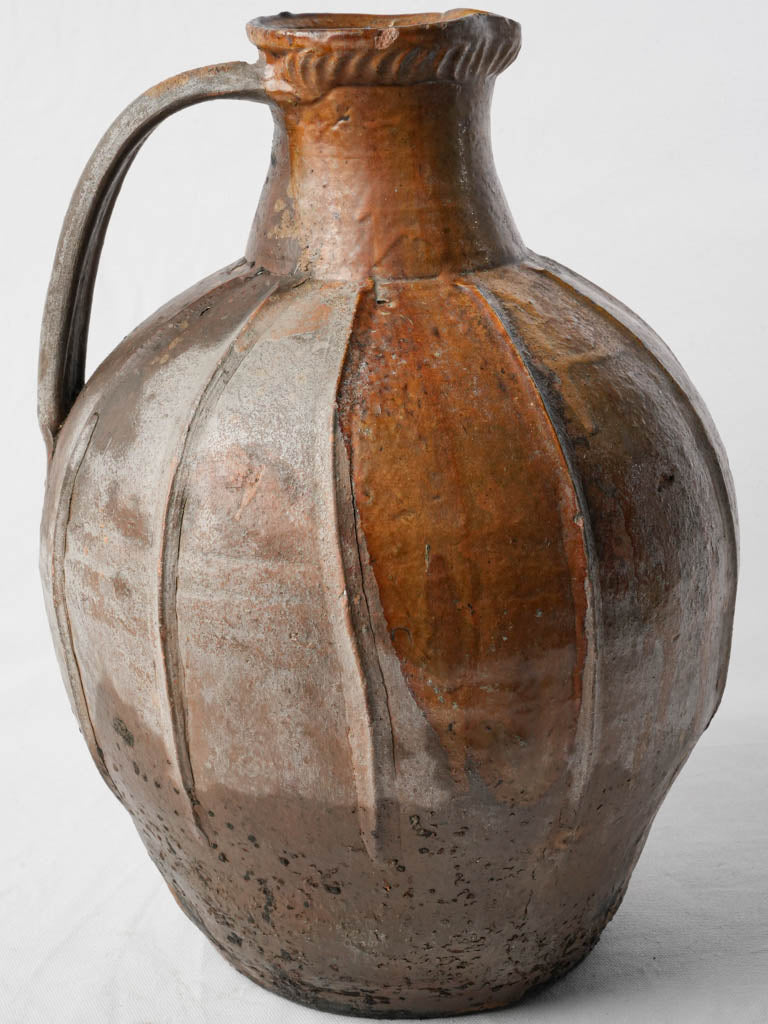 Artisanal timeworn terracotta jug