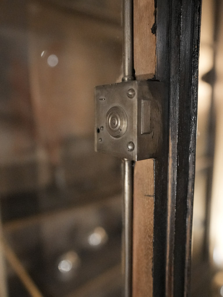 Sturdy and elegant black lacquer vitrine
