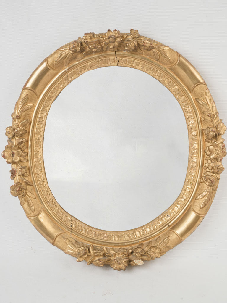 Antique gilded oval mirror
