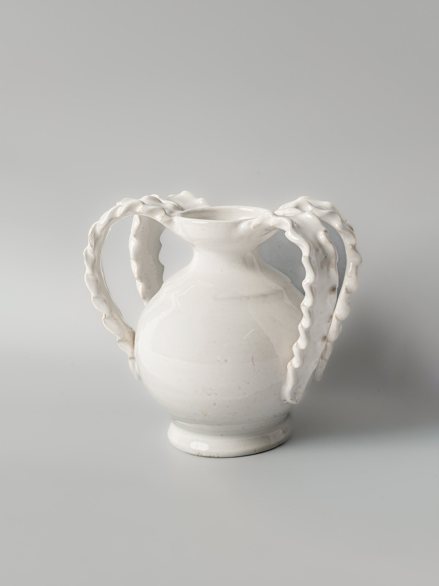 Textured looping-handle decorative pottery