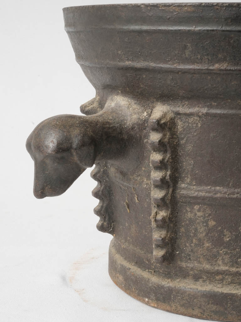 Timeworn patina dog-head handles