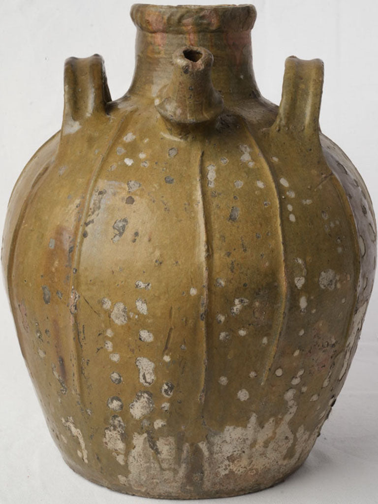 Aged Provençal glazed earthenware container
