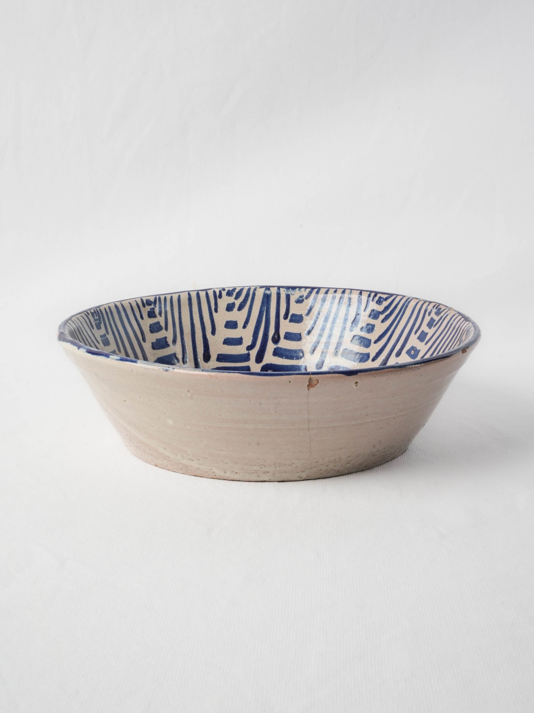 Handcrafted pottery bowl with floral motif