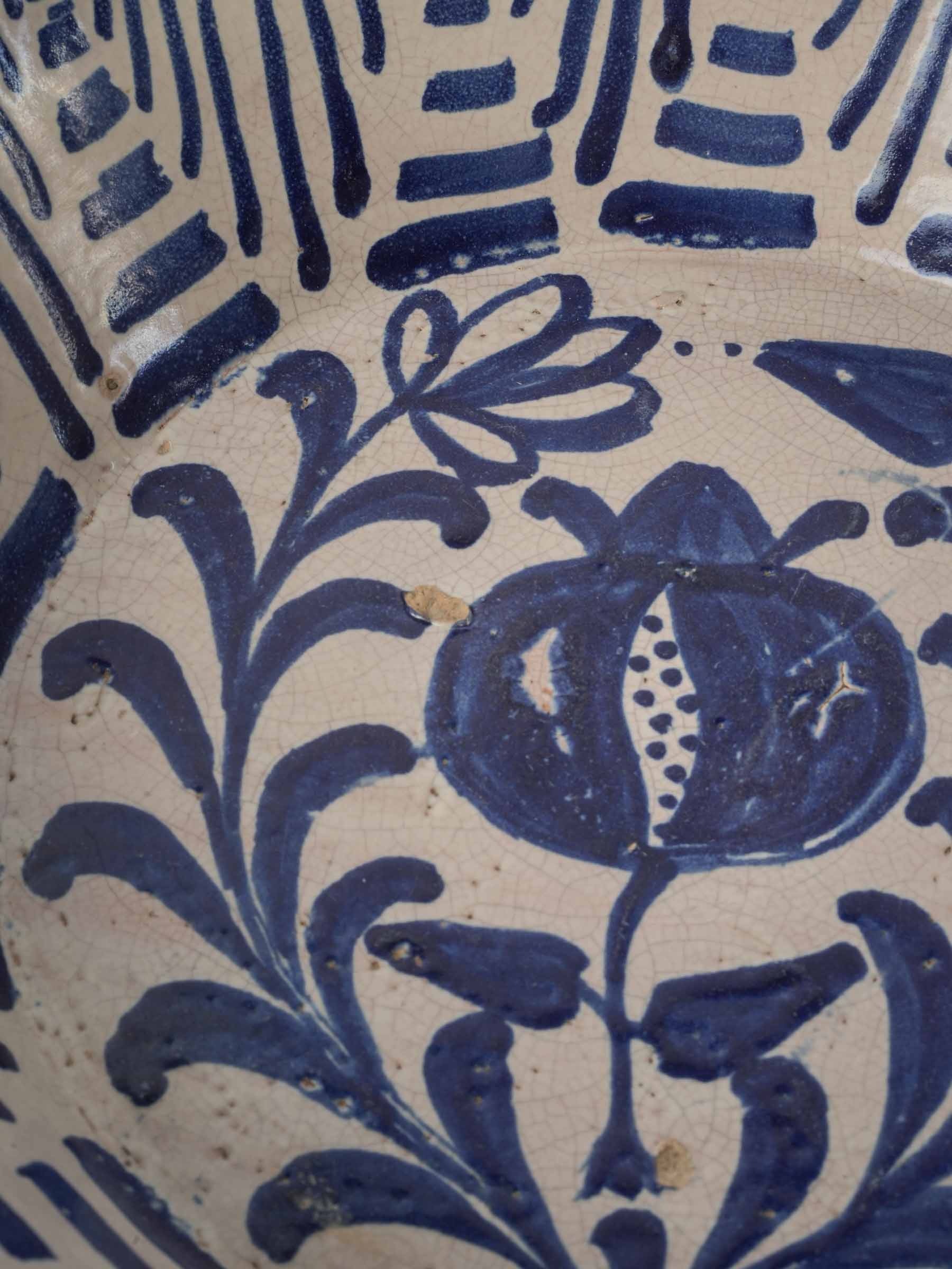Timeworn decorative bowl with expressive brushwork