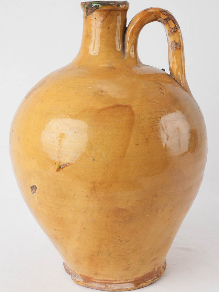 Old-world yellow French pottery vase