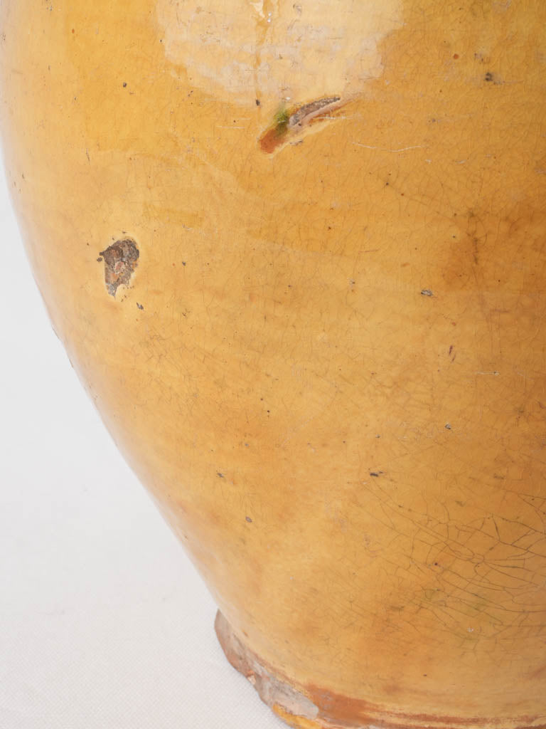 Rustic green-accented antique water pitcher