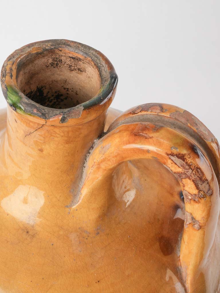 Aged ceramic green-yellow French cruche