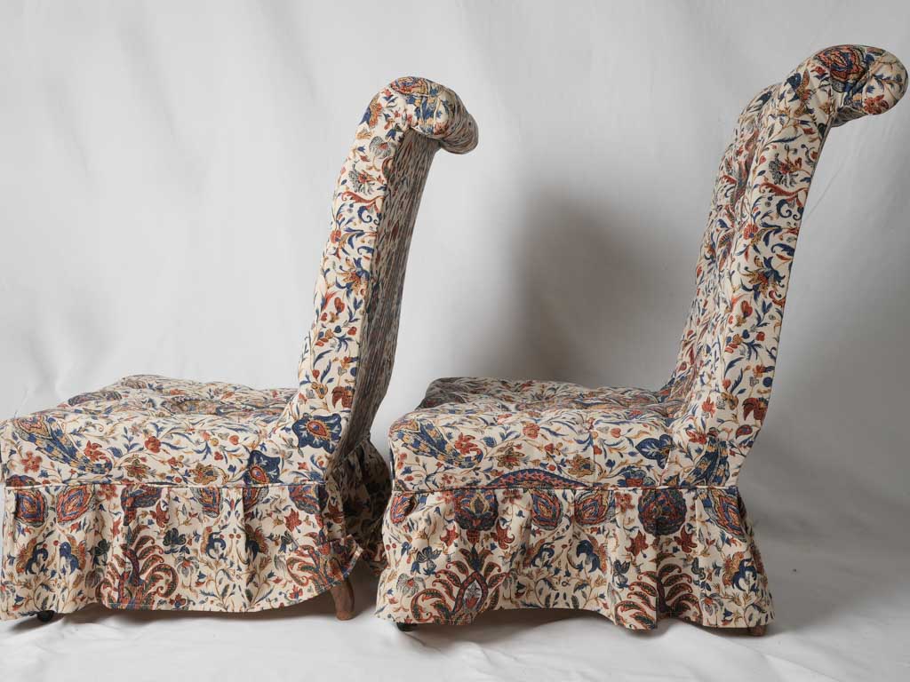 French walnut-legged lounge chairs
