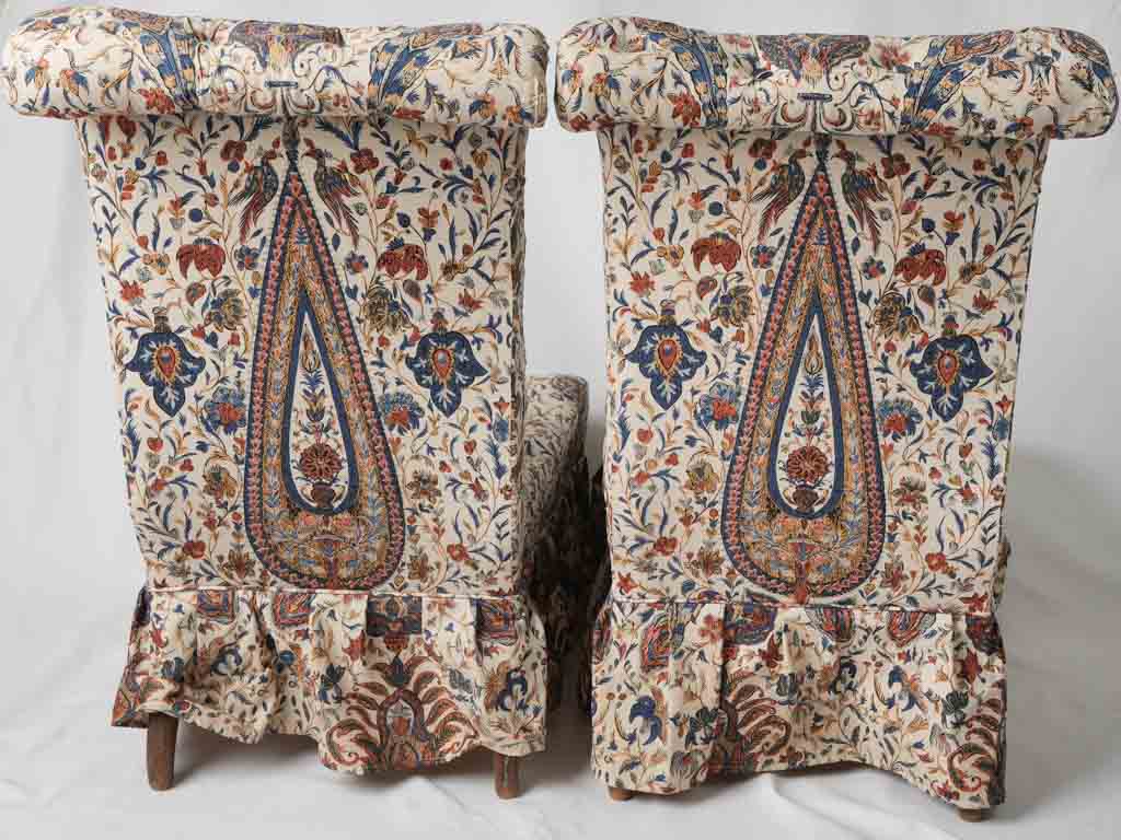 Elegant scrolled-back lounge chairs