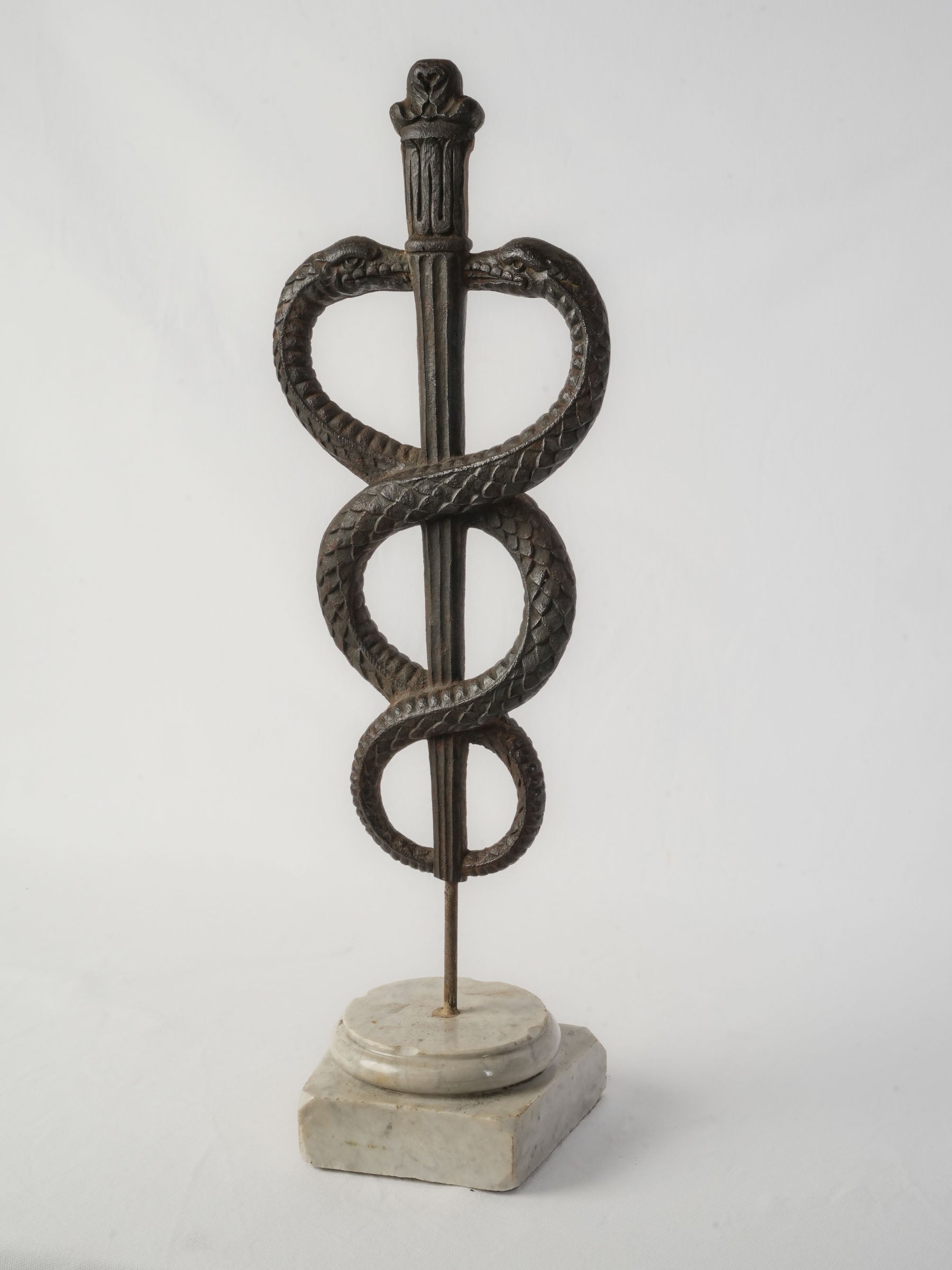 Aged cast-iron pharmacy sign.