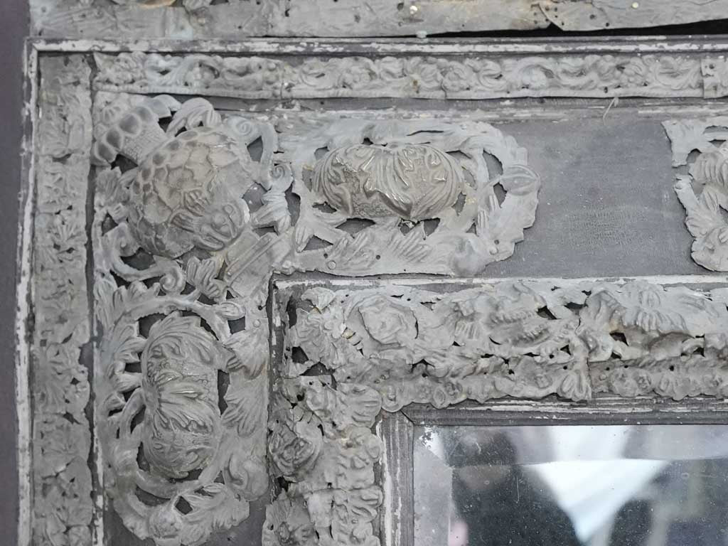 Custom-crafted repoussé zinc accent mirror