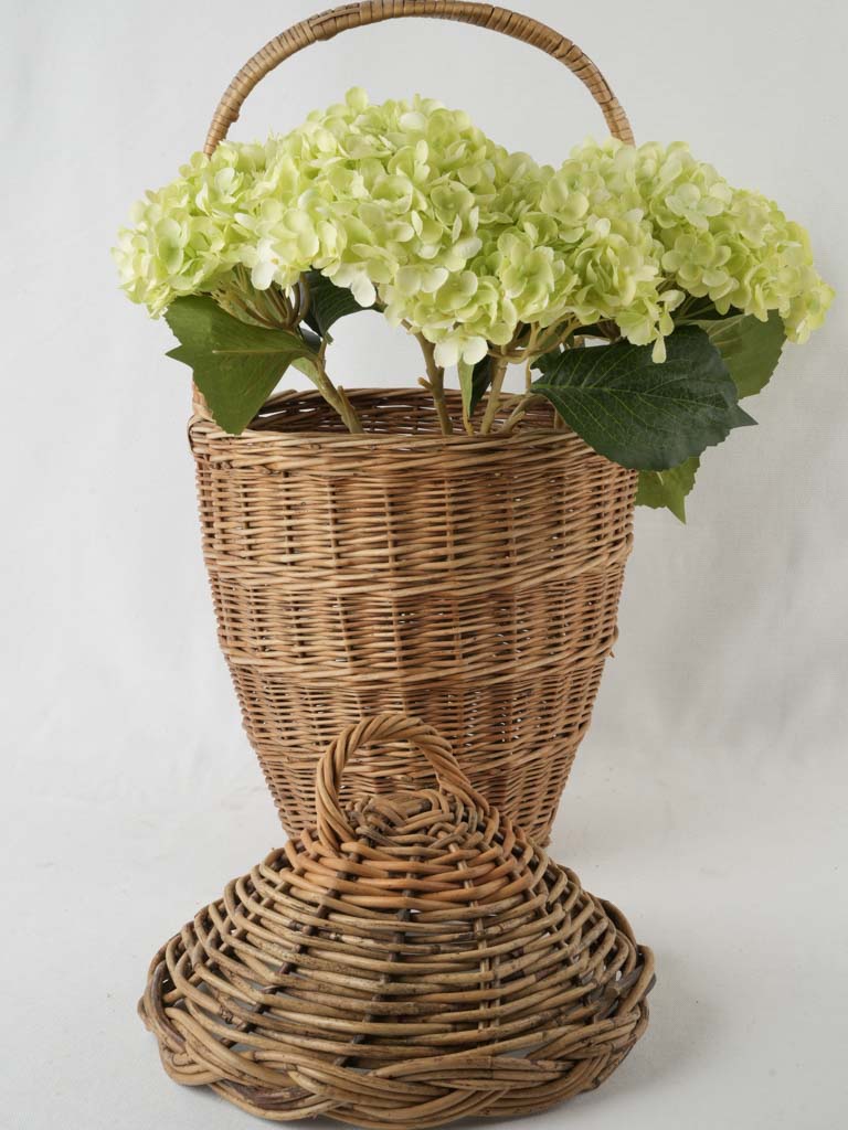 Weathered, rustic lidded wicker container