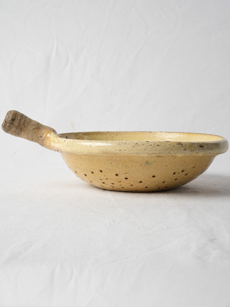 Rustic ochre-toned ceramic skimmer