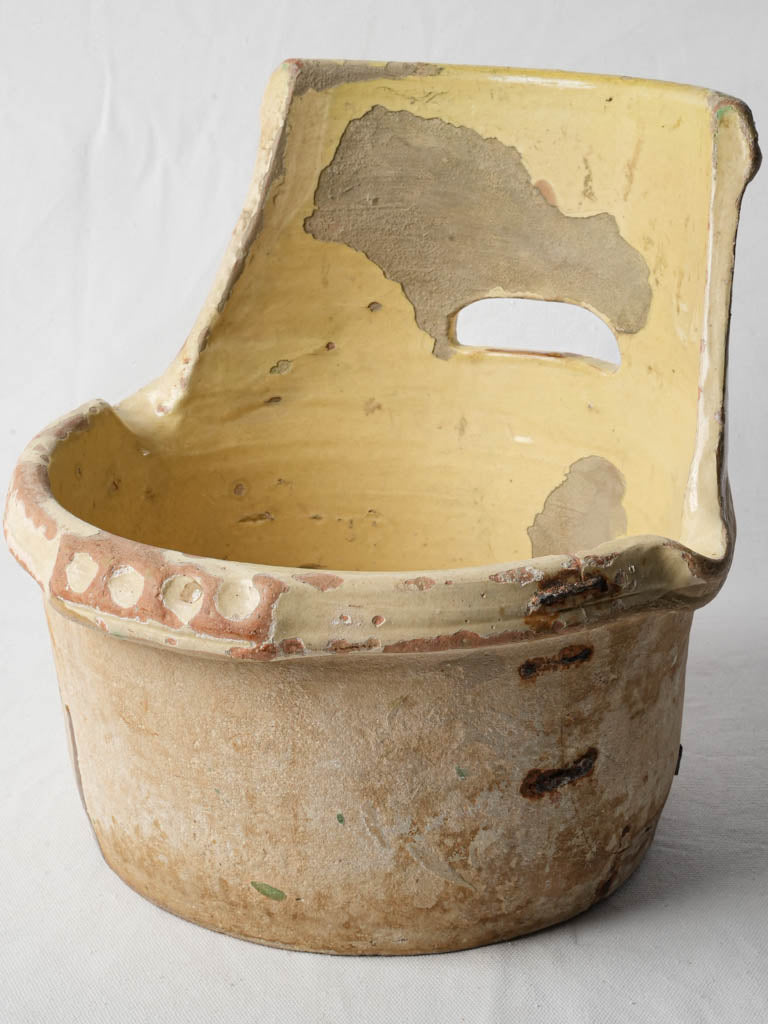 Rustic terracotta milking pail