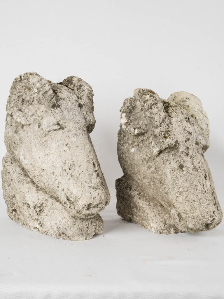 Pair of salvaged carved stone ram heads from a church 14¼"