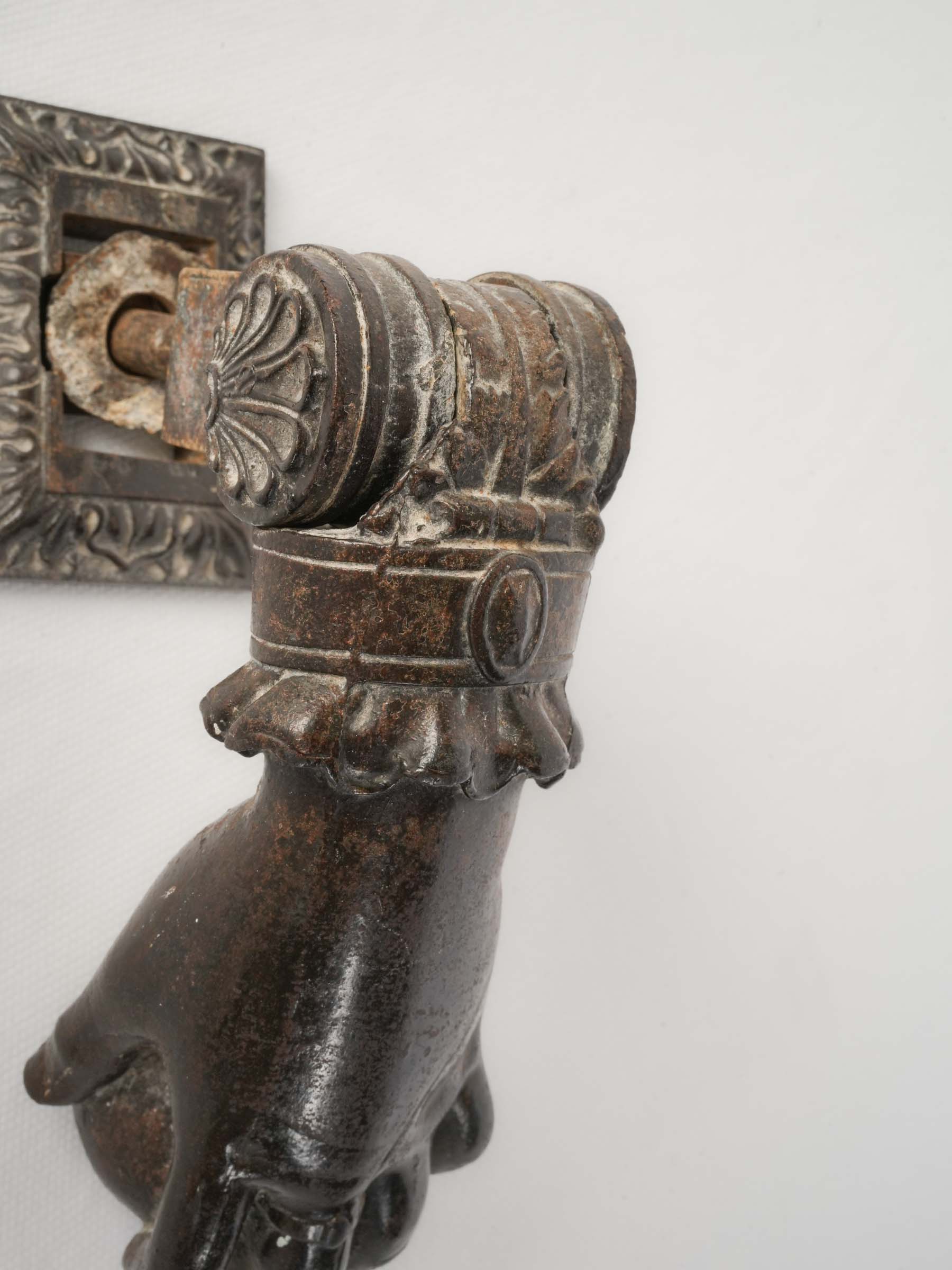 Detailed sculptural hand door knocker