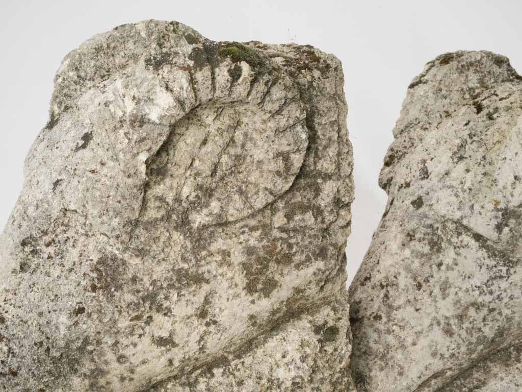 Pair of salvaged carved stone ram heads from a church 14¼"
