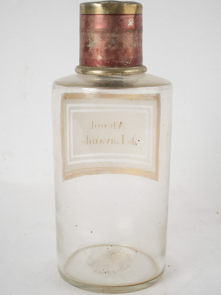 Patina-adorned tin lid pharmacy jar