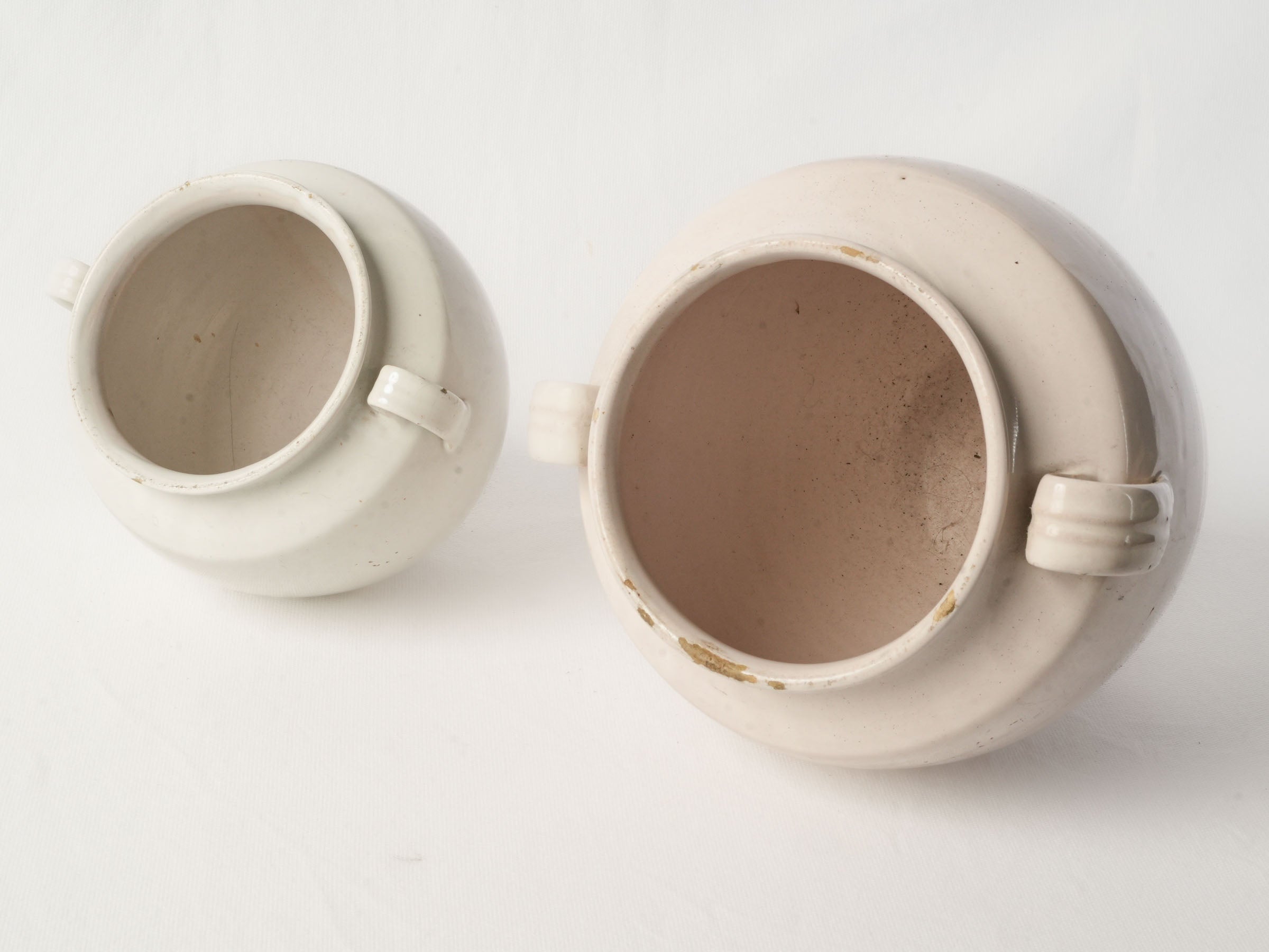 Subtly varied antique pottery pair