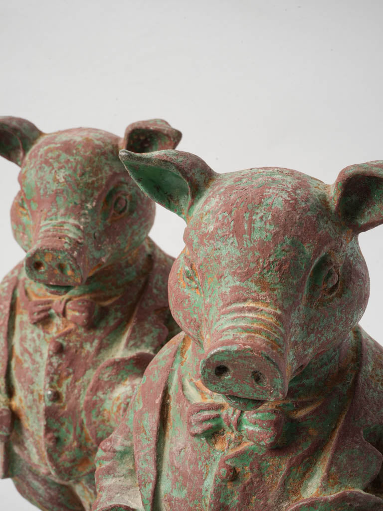 Distressed green painted pig sculptures