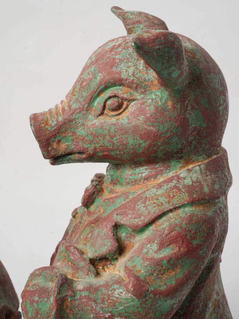 Expressive eyes dressed pig statuettes