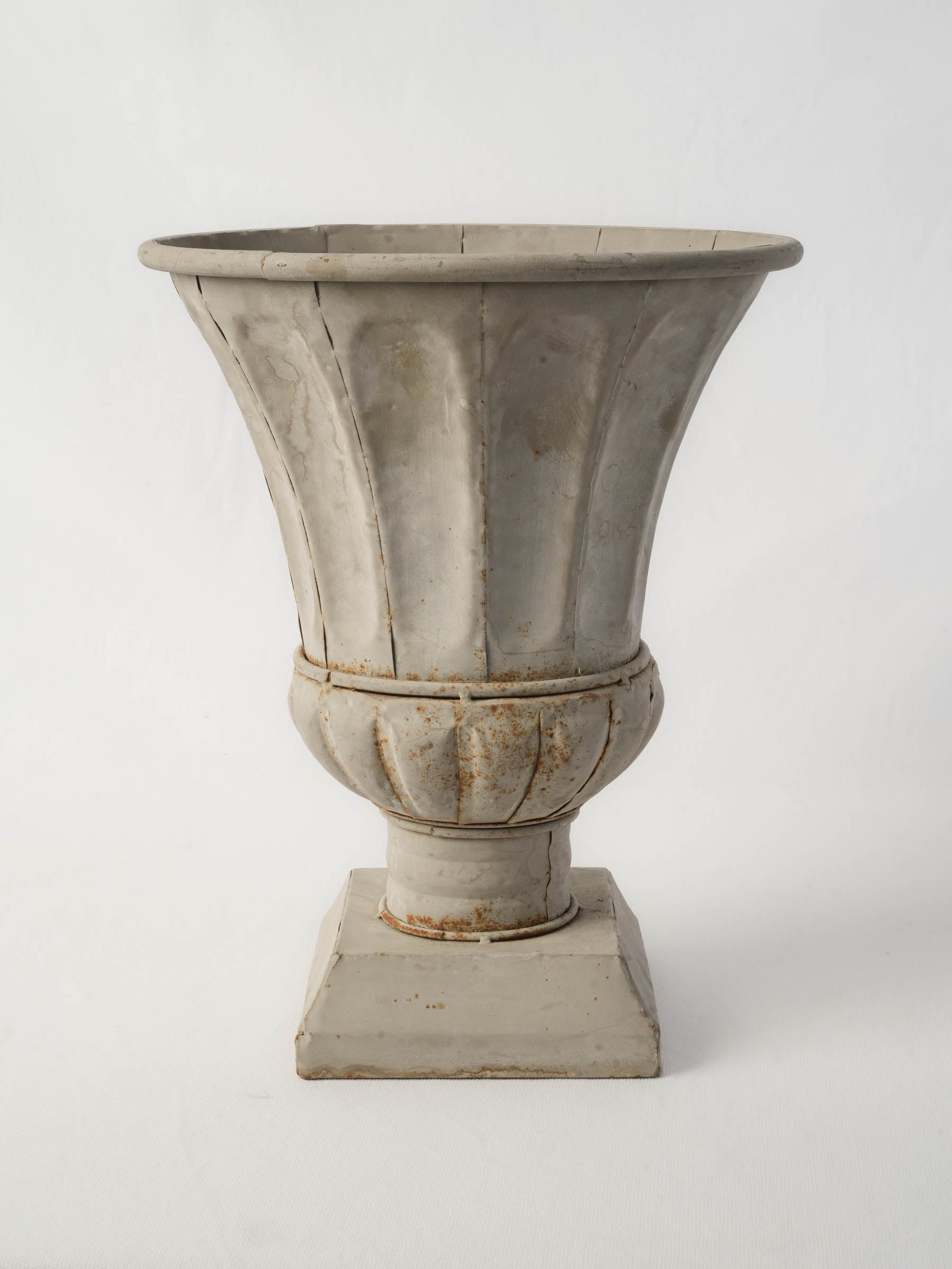 Weathered architectural zinc vase