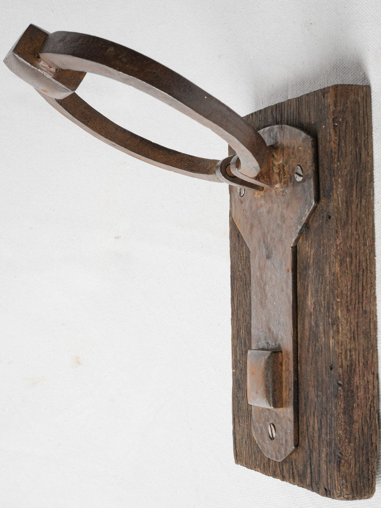 Decorative rustic wood-mounted door knocker