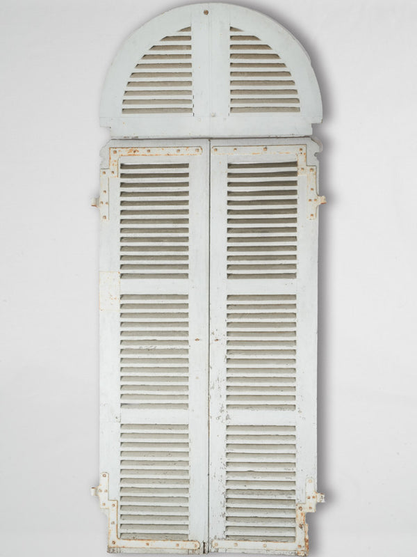 Antique weathered French arched shutters