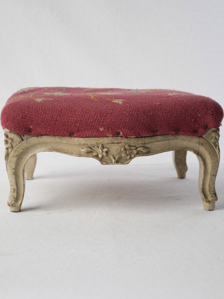 Timeworn ornate carving footrest