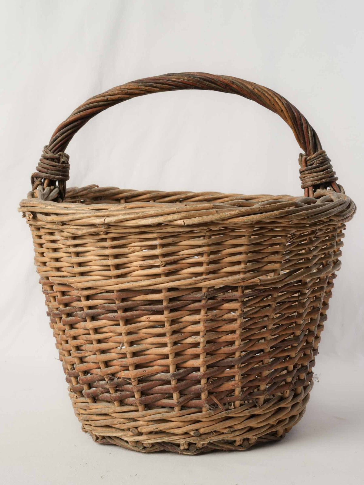 Weathered patina wicker basket