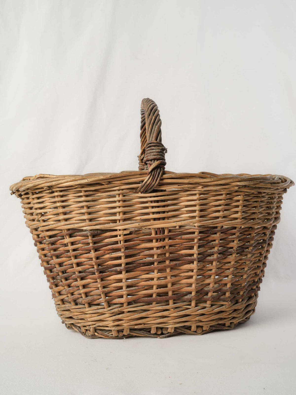 Twisted-handle wicker basket