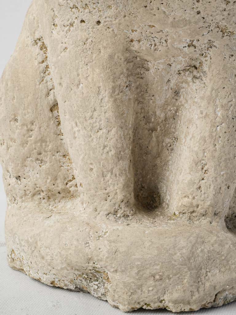 Whimsical lifelike feline stone sculpture