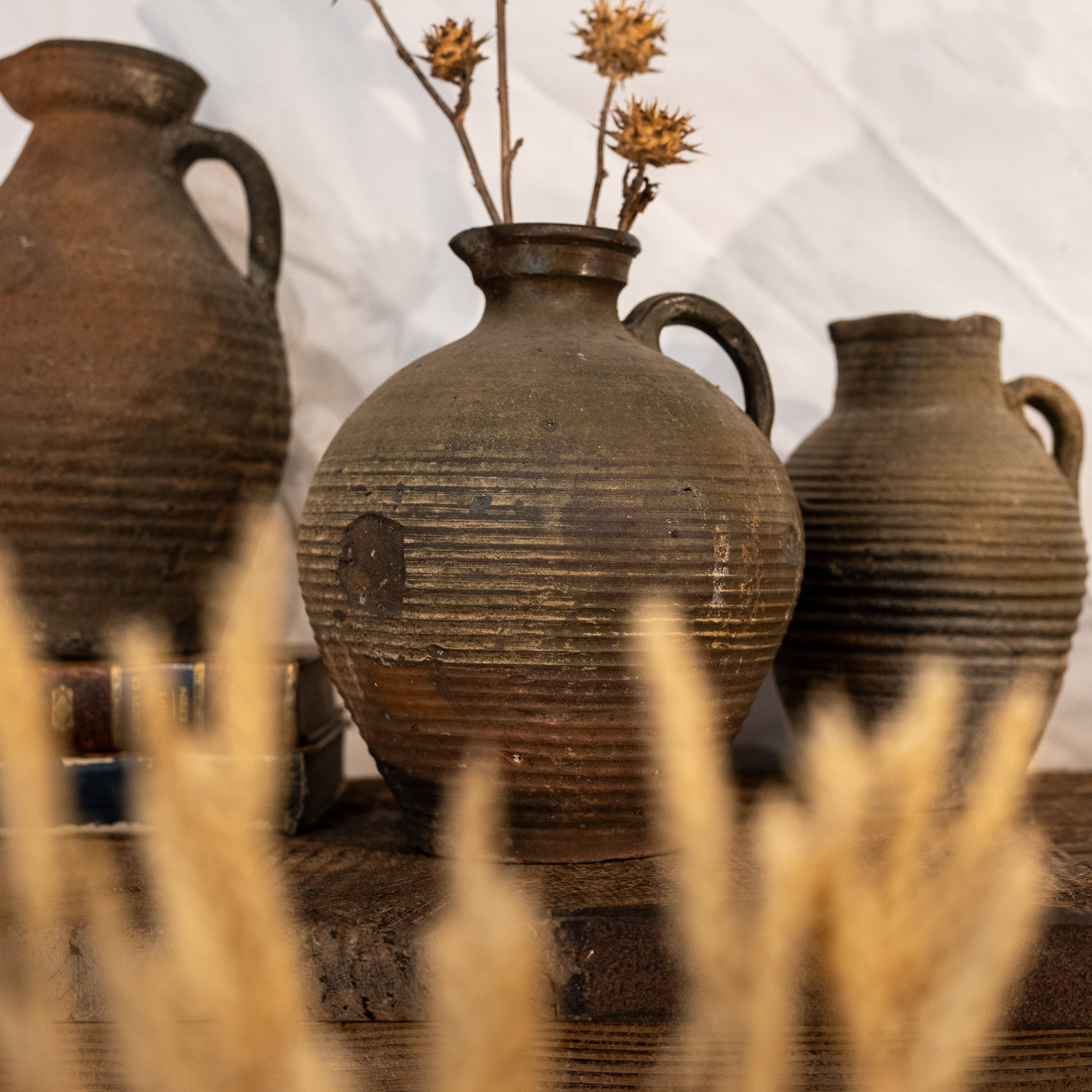 Half-glazed patina-detailed 19th-century clay pitcher