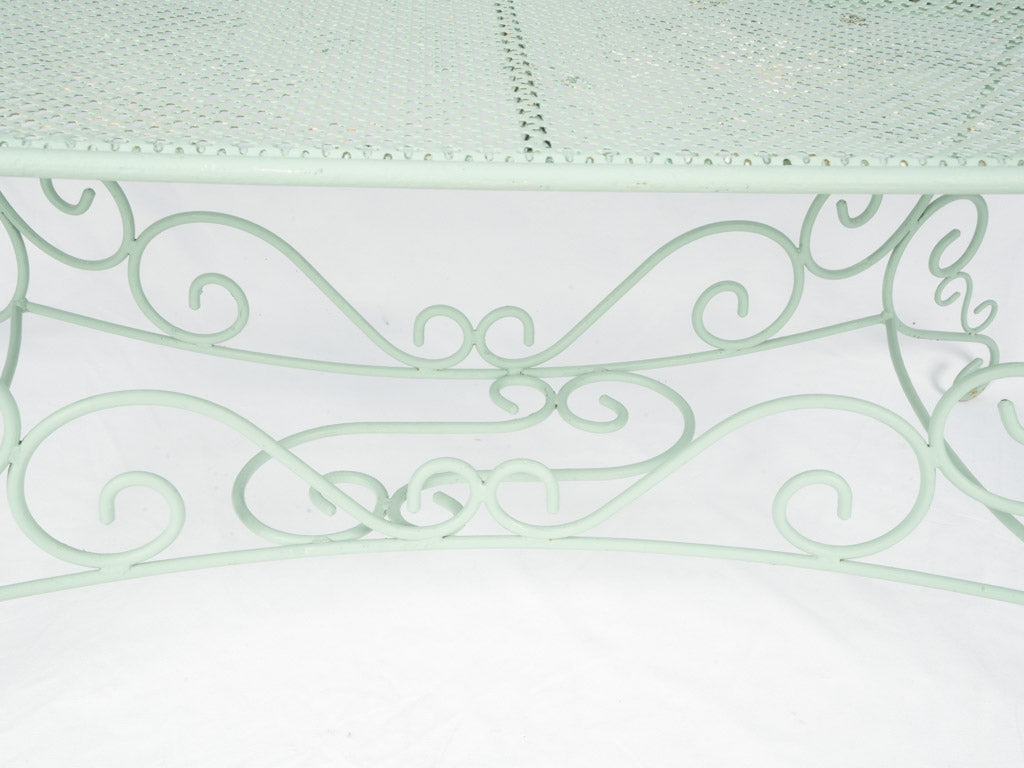 Intricate scrollwork wrought iron table