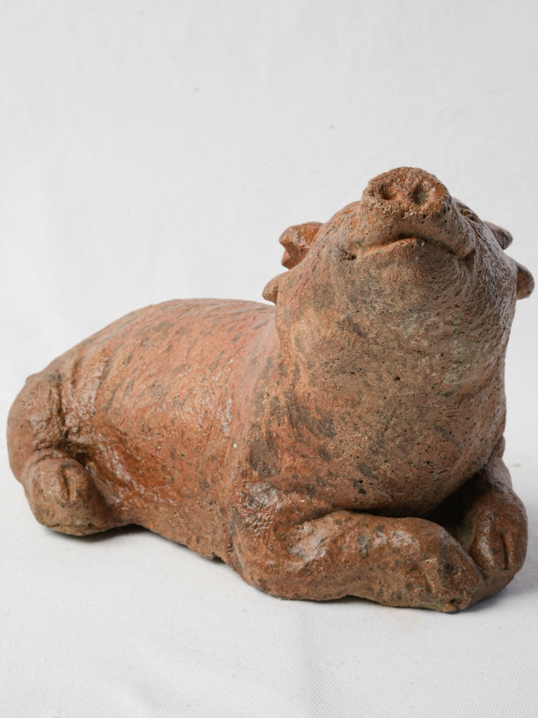 Endearing rustic-style pig statue