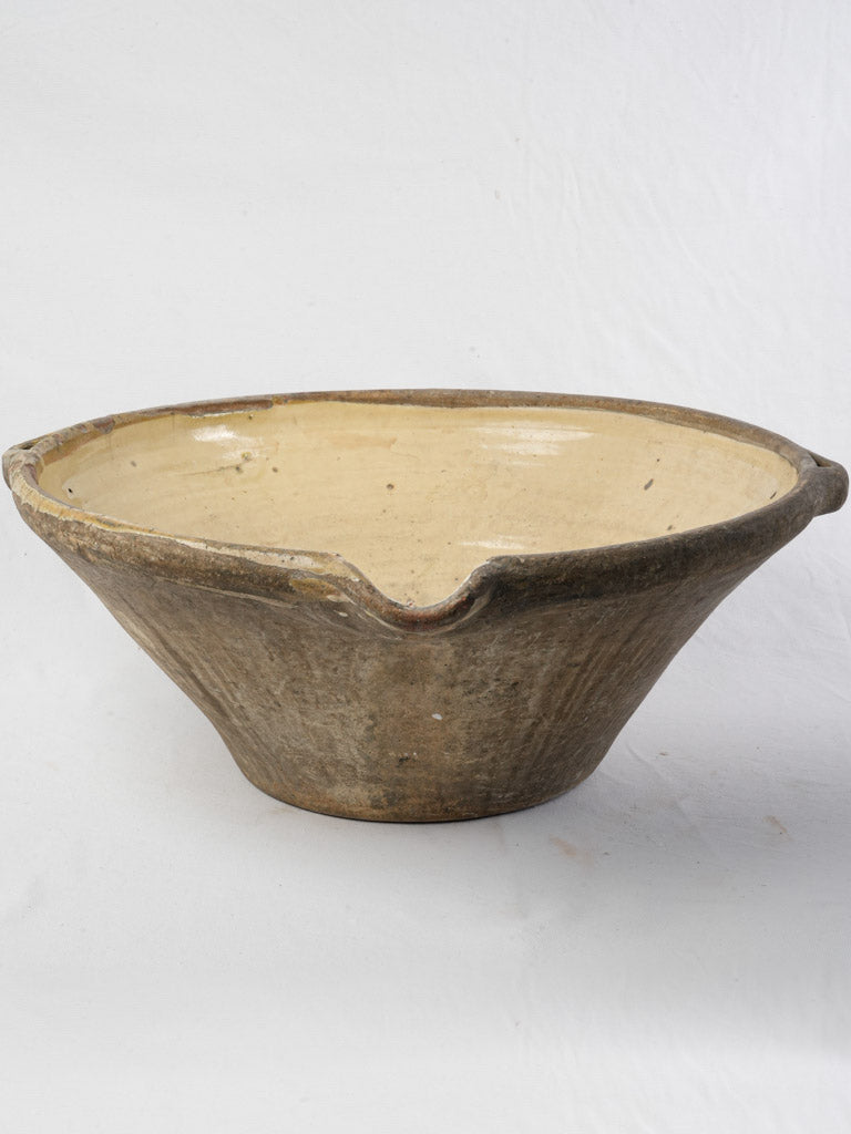 Yellow-glazed ceramic bowl with handles