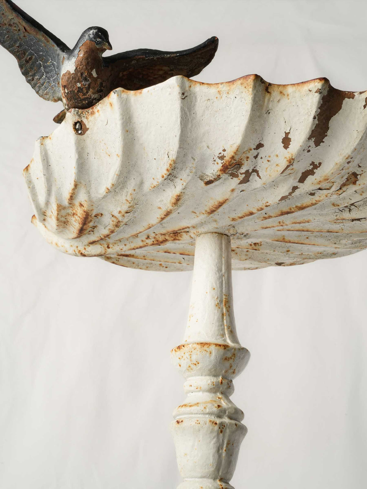 Evocative timeworn metal birdbath