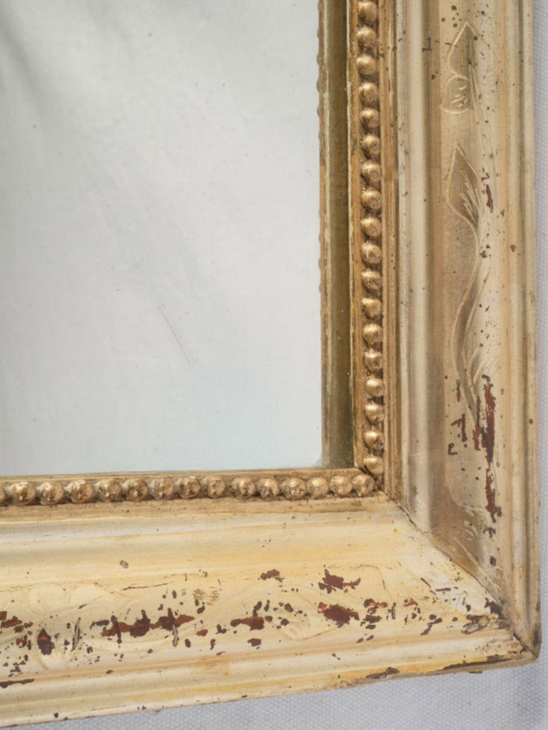 Decorative foxed glass wall mirror