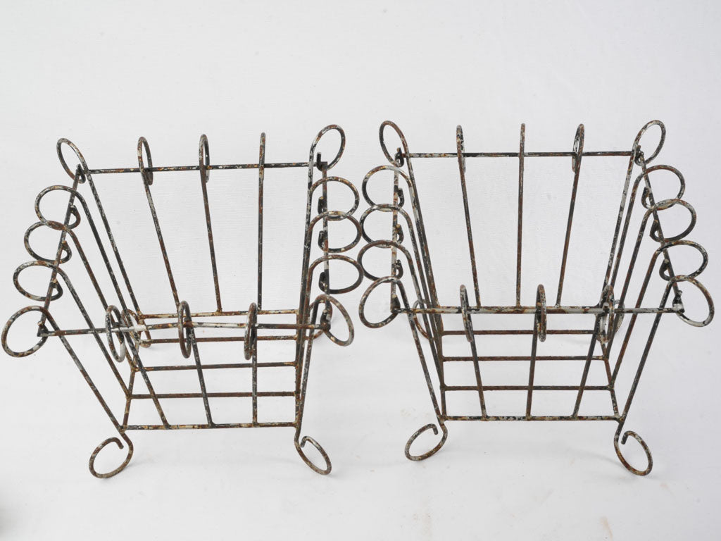 Delicate scrollwork iron holders