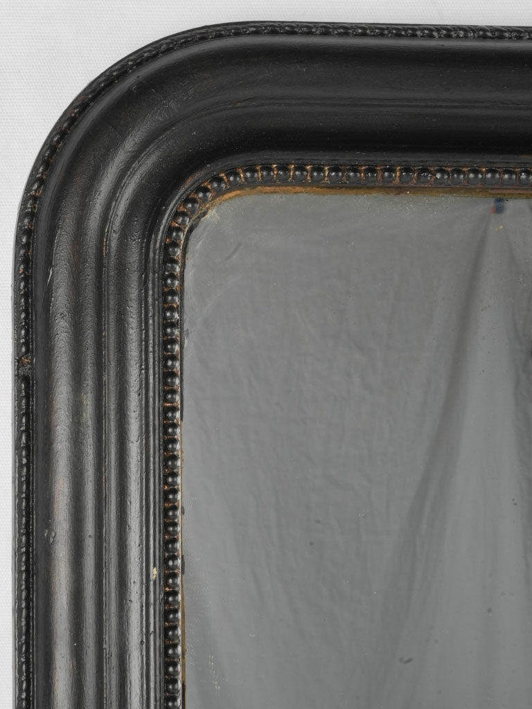 Time-worn chic black wall mirror
