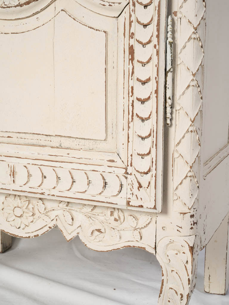Textured floral relief armoire.