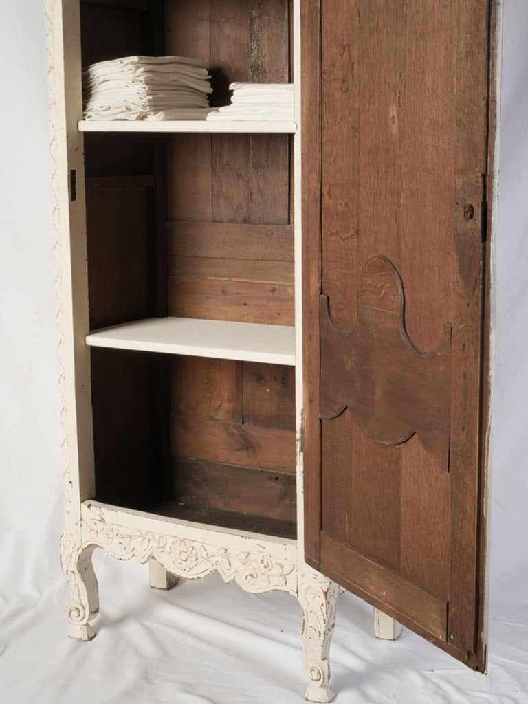 Scalloped apron wood armoire.