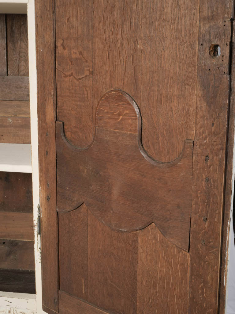 Graceful cabriole-legged armoire.