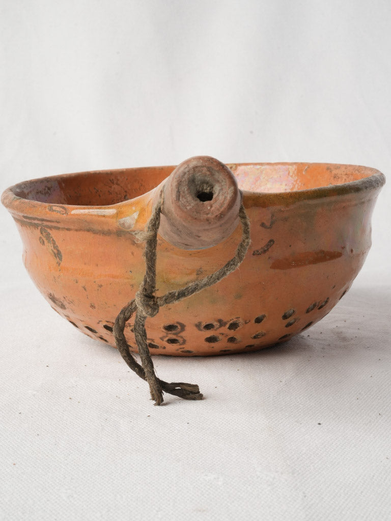 Tubular-handled earthenware kitchen tool