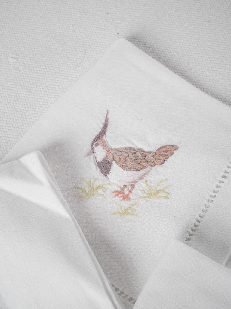 Whimsical embroidered hen lapwing napkins