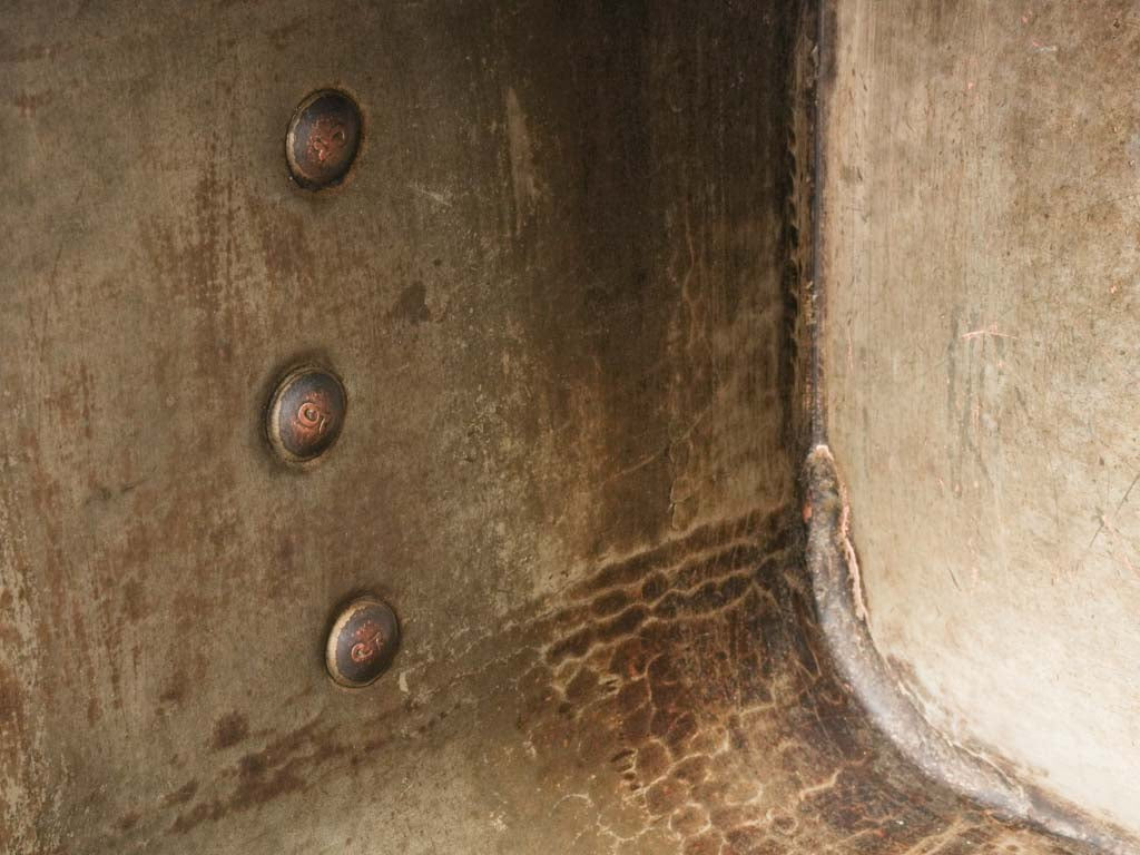 Traditional artisanal brass-handled pan