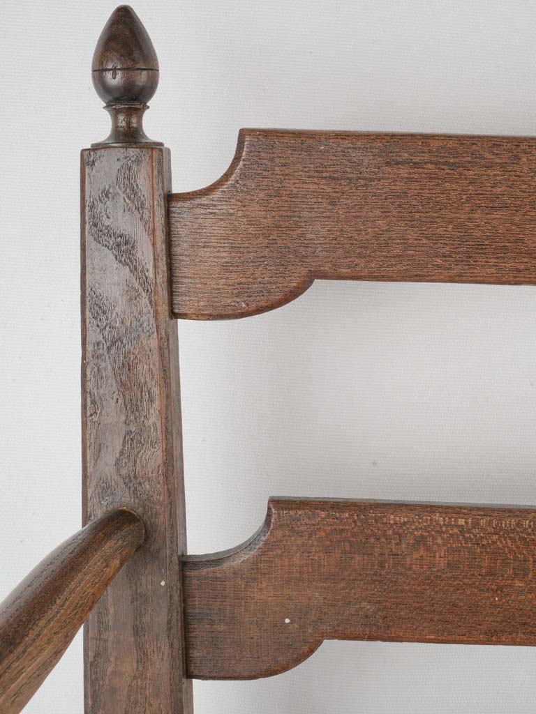 Weathered ladderback armchair with rush